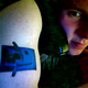 Image for article titled 12 Idiots With Hideous and Stupid Apple Tattoos